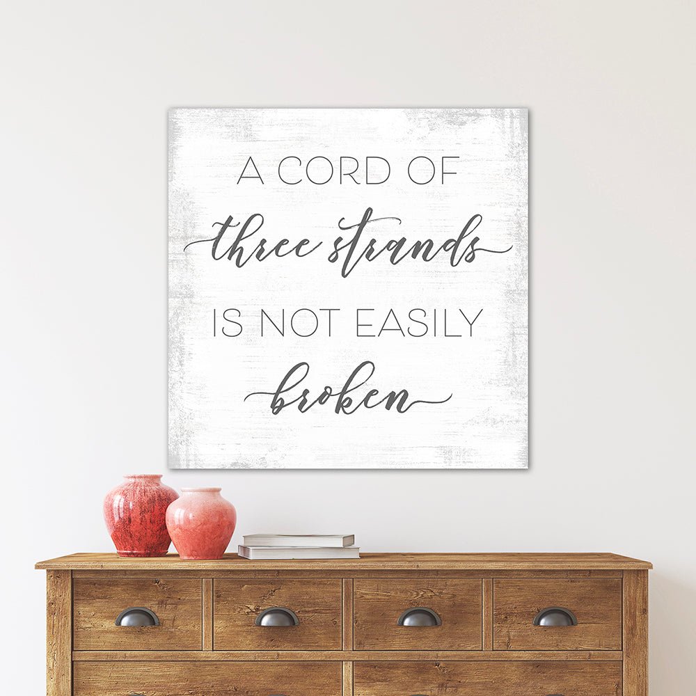 A Cord of Three Strands is Not Easily Broken Canvas Sign Above Dresser - Pretty Perfect Studio