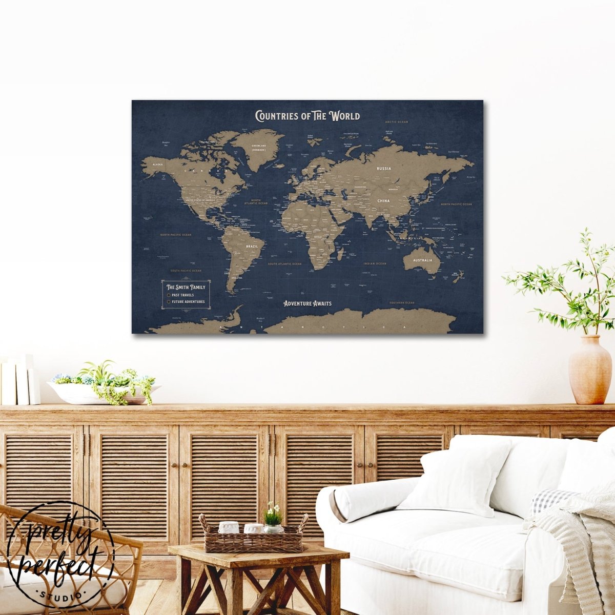 custom push pin world map canvas with navy background and vintage design, personalized travel map wall art in cozy living room above wood cabinet