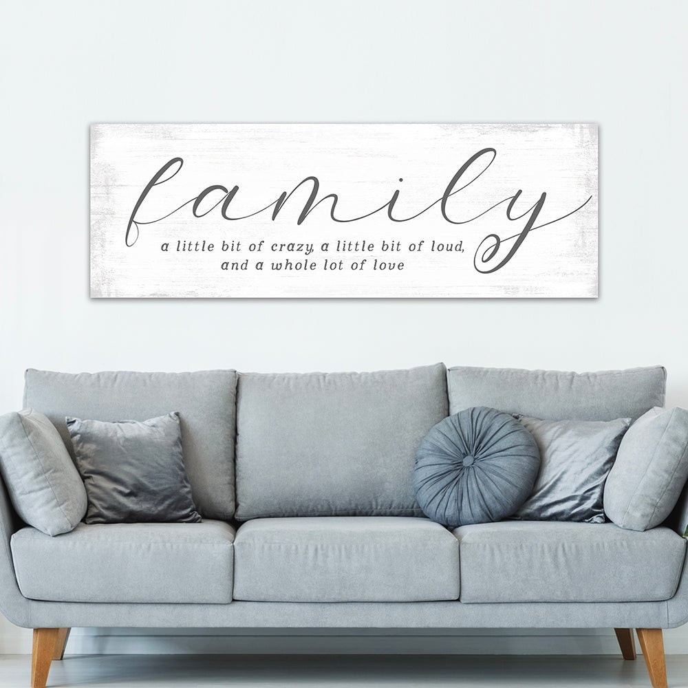 Family A Little Bit Of Crazy Sign Above Couch - Pretty Perfect Studio