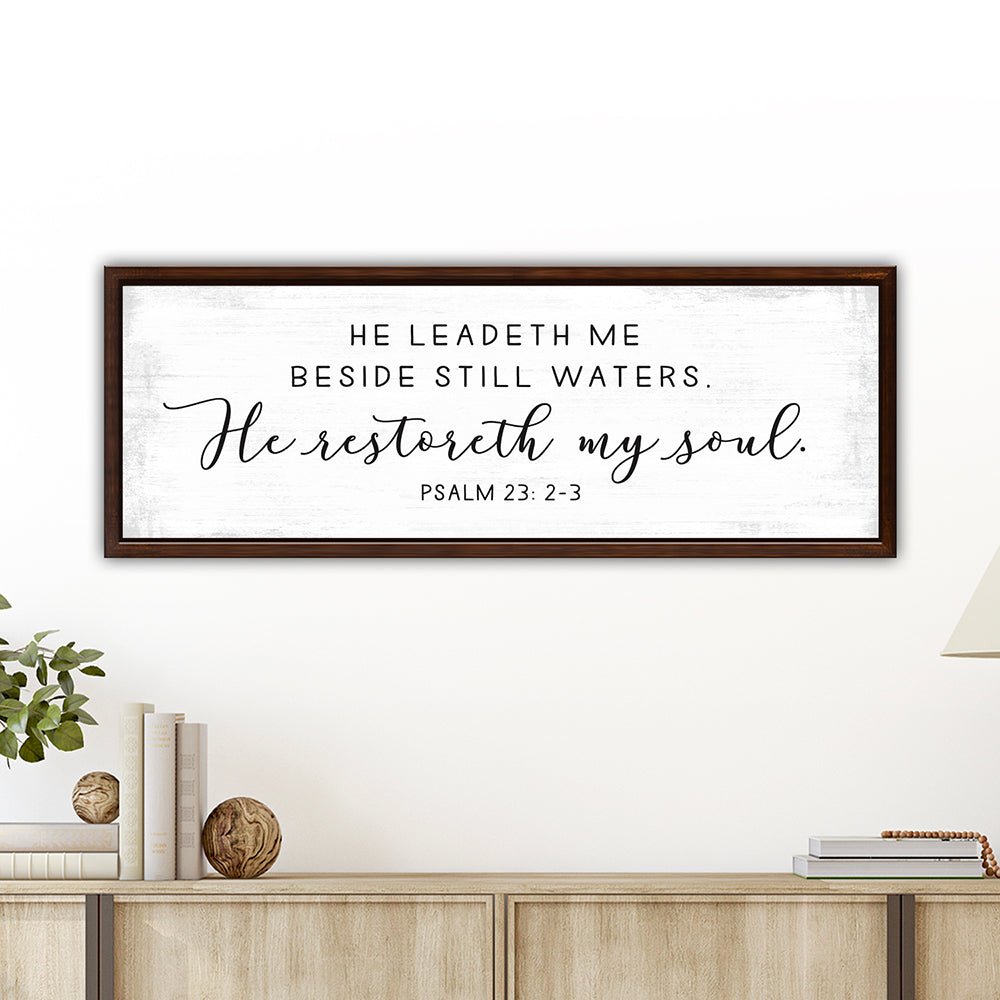 He Leads Me Beside Still Waters Psalm 23 Bible Verse Sign Above Table on Wall - Pretty Perfect Studio