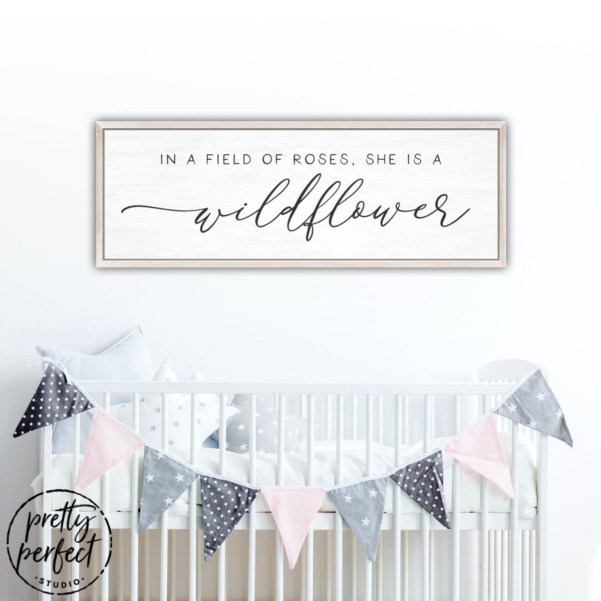 In A Field Of Roses She Is a Wildflower Sign Hanging Above Baby Crib - Pretty Perfect Studio