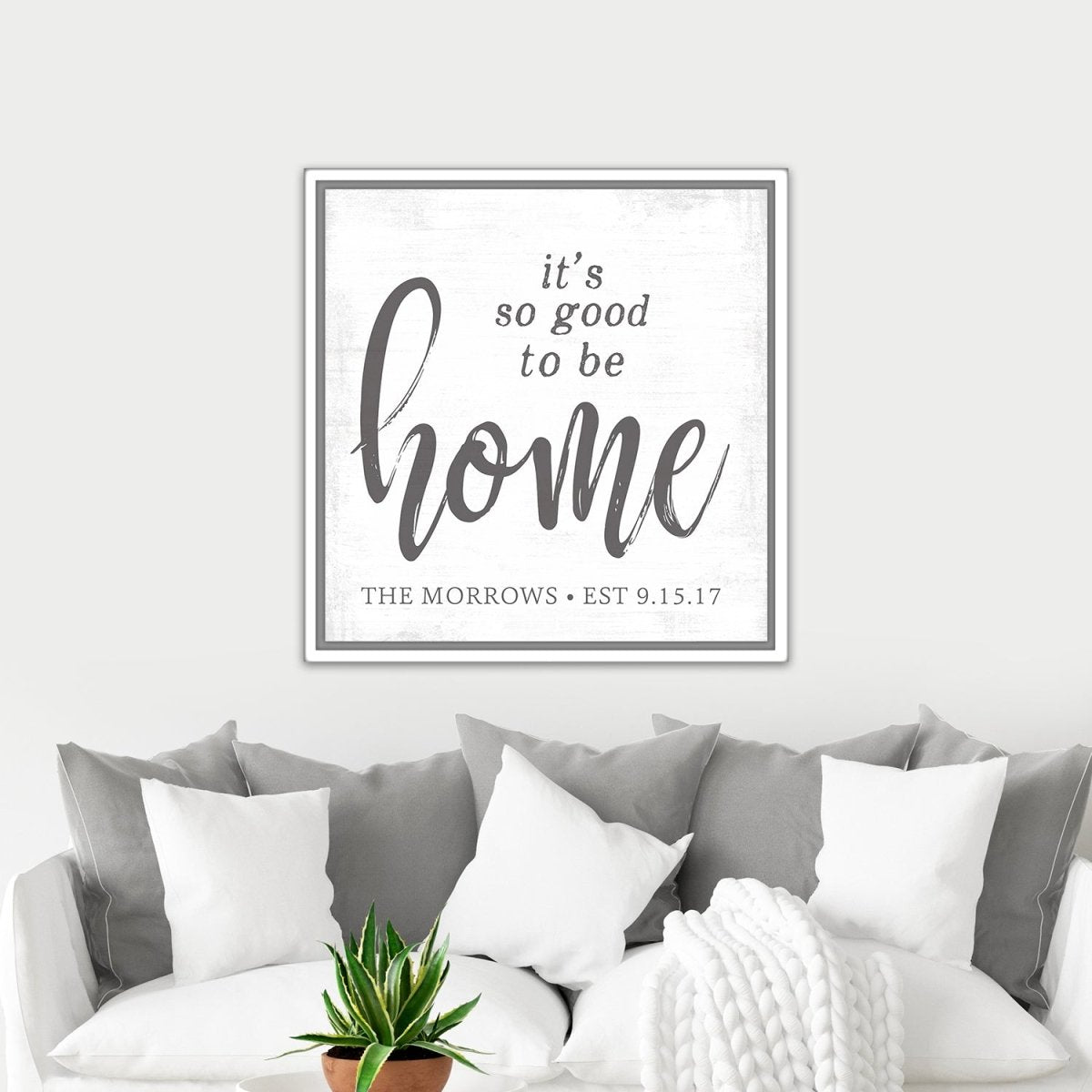 It's So Good To Be Home Family Name Sign Above Couch in Living Room - Pretty Perfect Studio