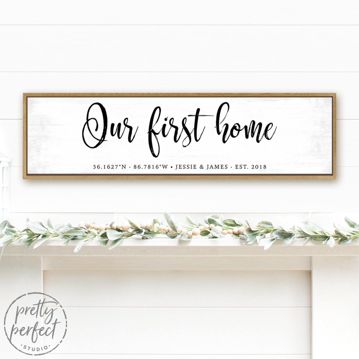 personalized our first home sign with GPS coordinates and couple names on distressed white background above decorated mantel shelf