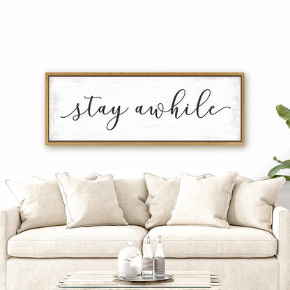 Stay Awhile Canvas Sign Hanging Above Couch - Pretty Perfect Studio