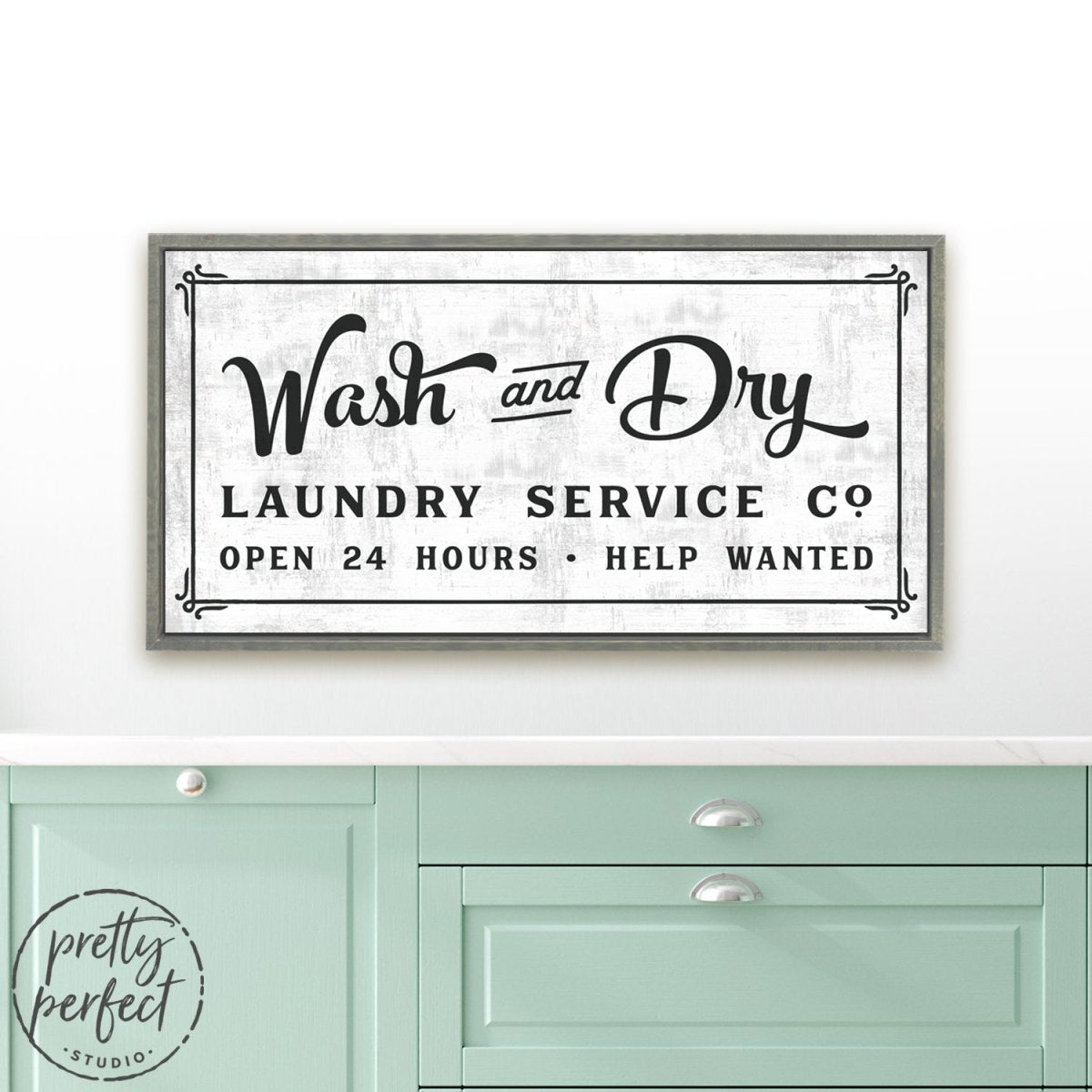 Wash and Dry Laundry Room Sign Hanging on Wall Above Folding Table - Pretty Perfect Studio