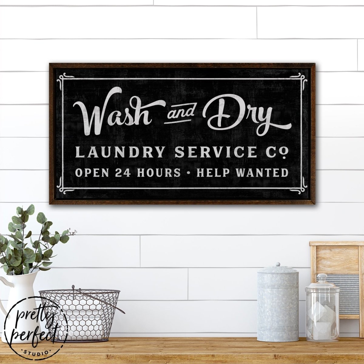 Wash and Dry Laundry Room Sign Hanging on Wall Above Folding Table - Pretty Perfect Studio