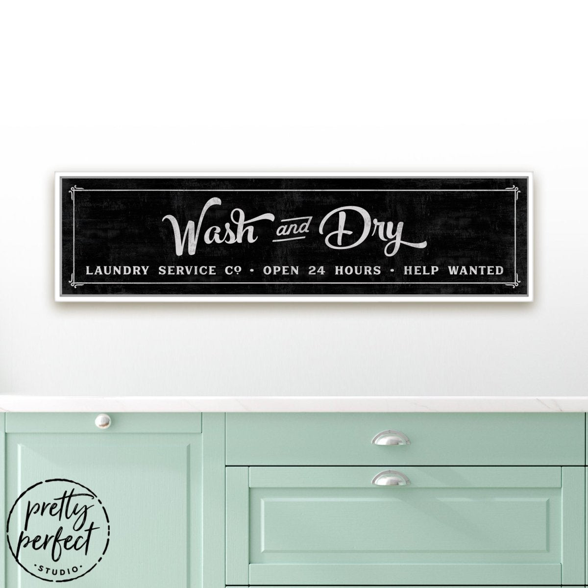 Wash and Dry Laundry Room Sign Hanging on Wall Above Folding Table - Pretty Perfect Studio