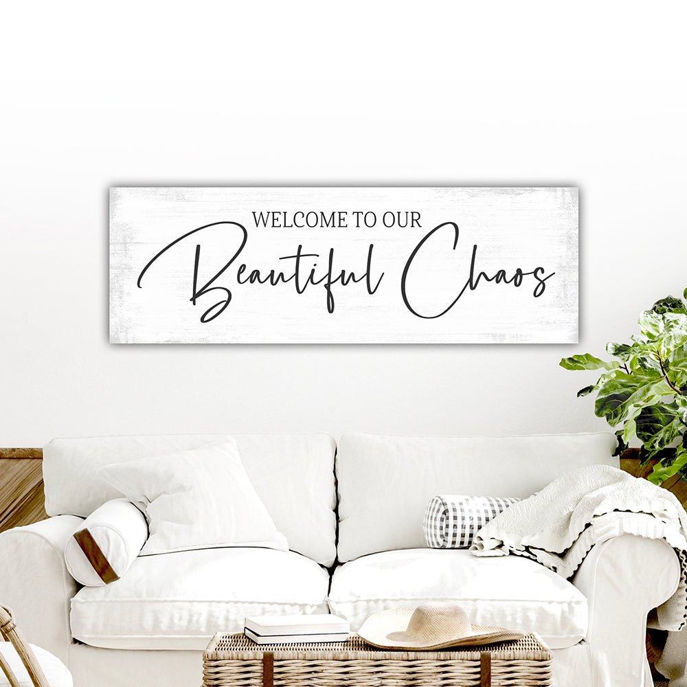 Welcome To Our Beautiful Chaos Sign Above Above Couch - Pretty Perfect Studio