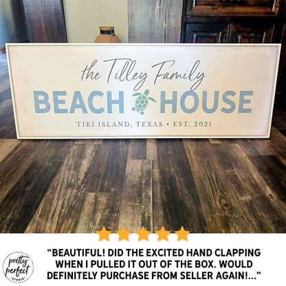 personalized beach house sign with family name, custom coastal wall art with turtle design and location, beach home decor sign for vacation house, seaside family name sign gift, customer review photo showing large beach house sign on floor