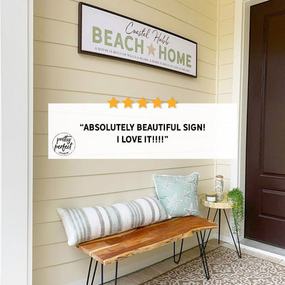 personalized beach home sign on front porch wall, custom coastal decor with text “Beach Home”, seaside entryway styling with bench and pillows, beach house welcome sign, customer review photo showing coastal porch decor and framed beach sign