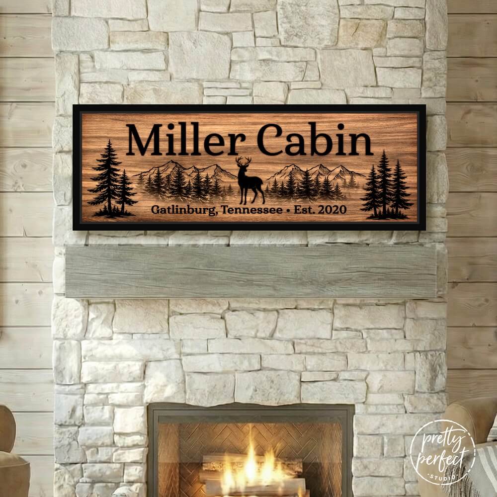 Personalized Miller Cabin sign displayed above a cozy indoor fireplace.