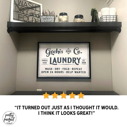 Gochis and Co Laundry wall sign in farmhouse laundry room, featuring Toole Utah design with “Wash Dry Fold Repeat” text, modern rustic laundry decor displayed under shelf