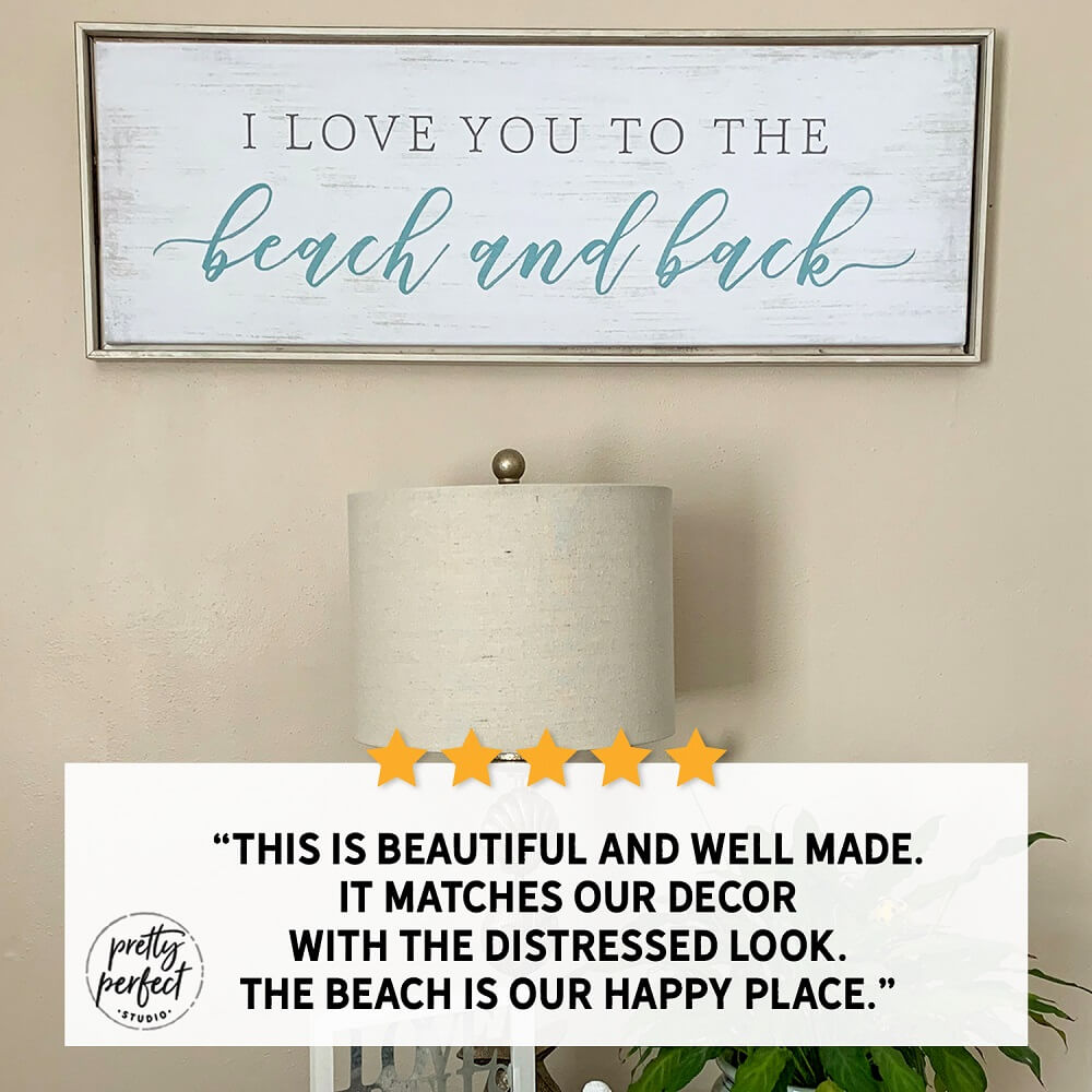 “I love you to the beach and back” coastal farmhouse wall sign with distressed white wood look, beach house decor displayed above table lamp