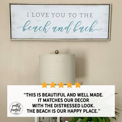 “I love you to the beach and back” coastal farmhouse wall sign with distressed white wood look, beach house decor displayed above table lamp