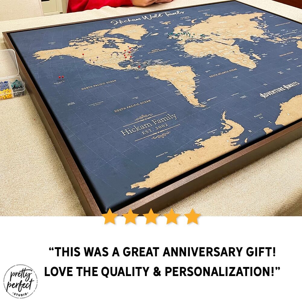Personalized world map anniversary gift with push pins, custom travel map wall art with names and date, framed navy and gold map decor for couples who love to travel