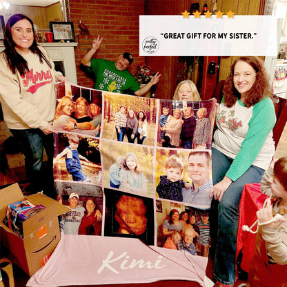 Two women holding a large photo collage blanket with family images.