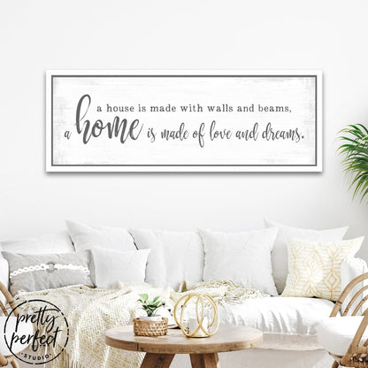 A Home Is Made Of Love and Dreams Sign Above Couch in Living Room - Pretty Perfect Studio
