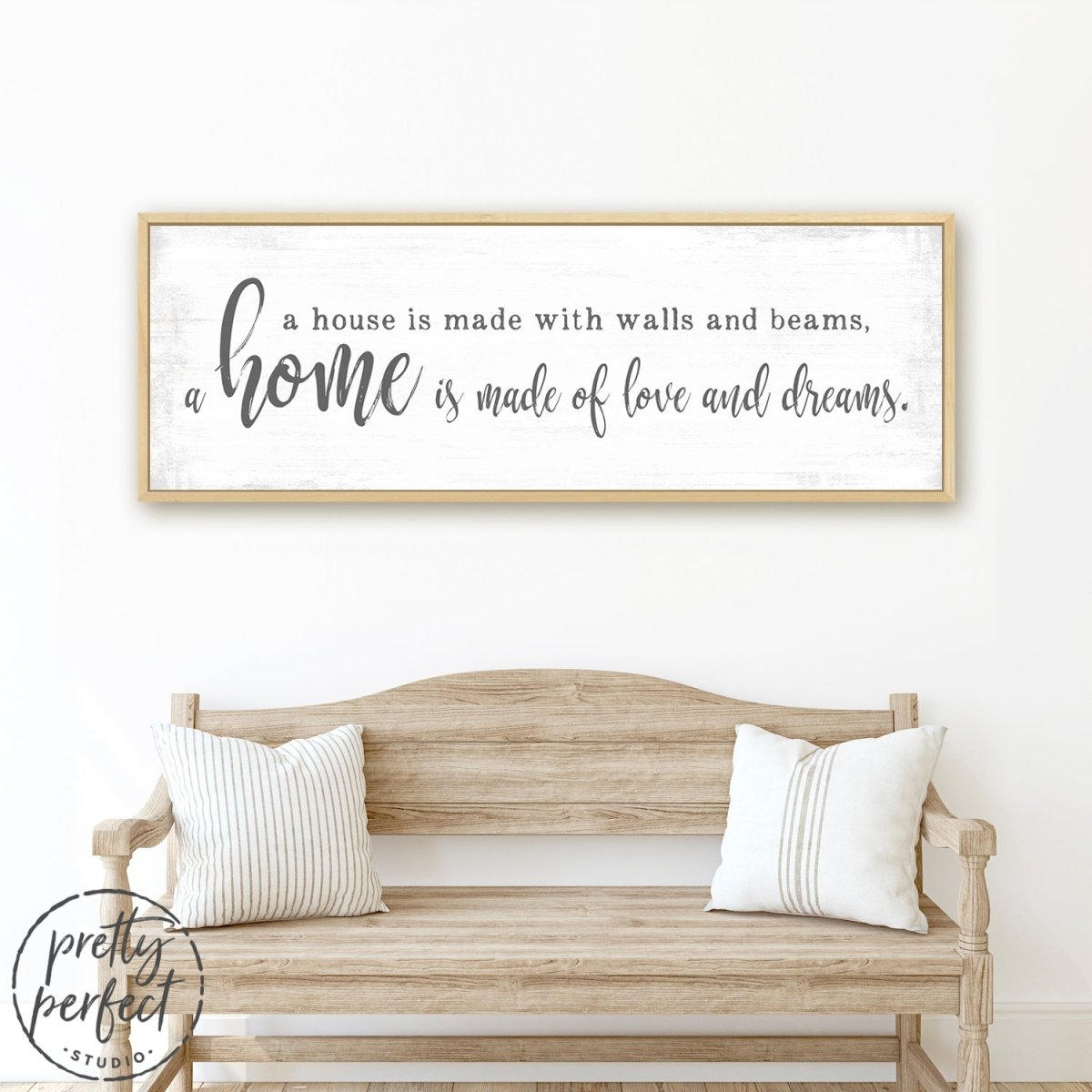 A Home Is Made Of Love and Dreams Sign Above Couch in Living Room - Pretty Perfect Studio