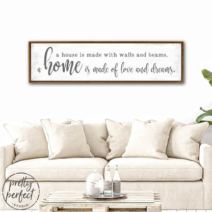 A Home Is Made Of Love and Dreams Sign Above Couch - Pretty Perfect Studio