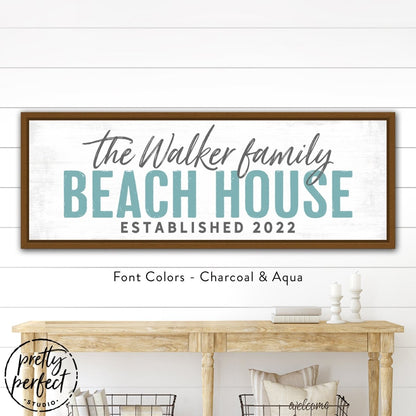 Close-up of distressed style beach house sign with rustic coastal finish