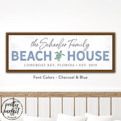 personalized beach house sign with family name, custom coastal wall decor with sea turtle design, blue and charcoal beach house wall art in light wood frame, custom seaside family name sign with location and date