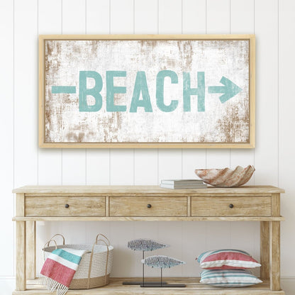 Beach and lake themed sign styled in a coastal-inspired room with light decor