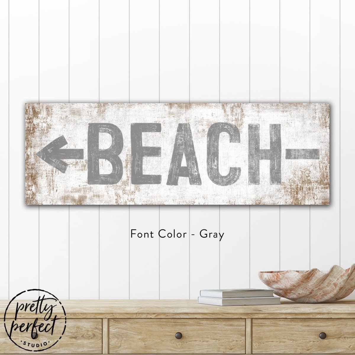 Rustic beach sign wall art with distressed wood texture and bold typography