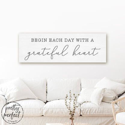 Begin Each Day With A Grateful Heart Canvas Sign Above Couch in Family Room - Pretty Perfect Studio