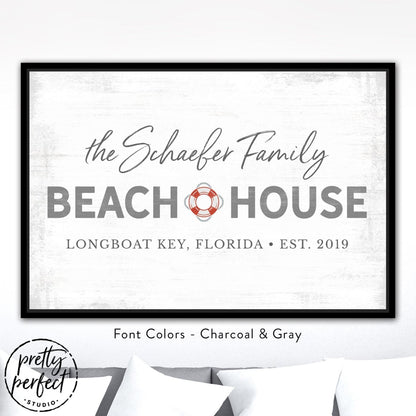 personalized beach house sign with family name, custom coastal wall decor with life preserver design, charcoal and gray beach house wall art in black frame, custom seaside family name sign with location and date