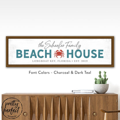 personalized beach house sign with family name, custom coastal wall decor with crab design, teal and charcoal beach house wall art in wood frame, custom seaside family name sign for entryway decor