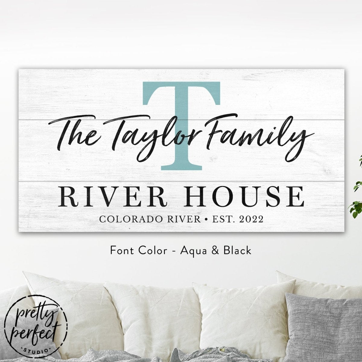 Lake house family name sign displayed in modern living room