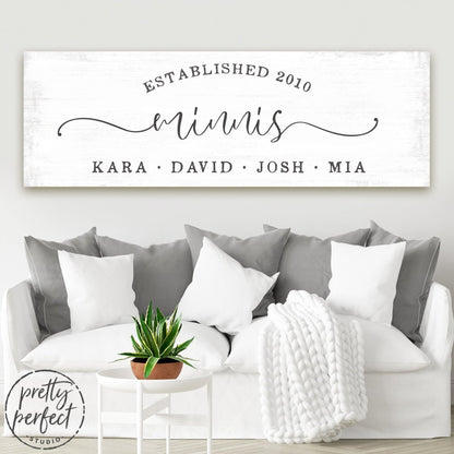 personalized family wall decor with last name, city, and custom text in minimalist rustic design on lightly distressed canvas in cozy family room