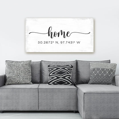personalized home coordinates canvas wall art with distressed white background above modern gray sectional sofa