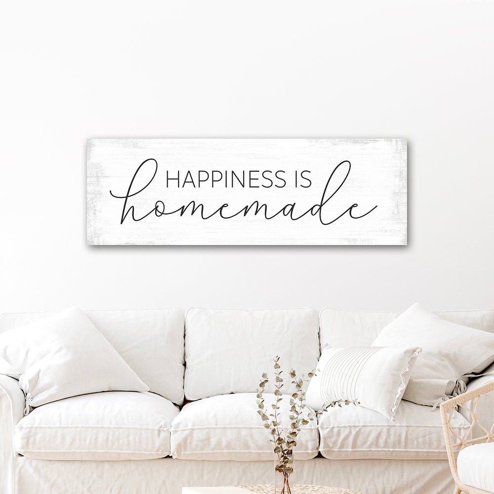 Happiness Is Homemade Canvas Sign Hanging on the Wall Above Couch - Pretty Perfect Studio