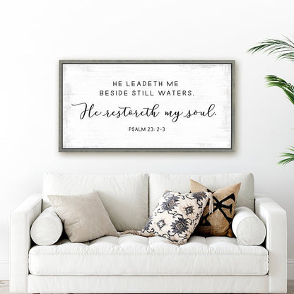 He Leads Me Beside Still Waters Psalm 23 Bible Verse Sign Hanging on the Wall Above Couch - Pretty Perfect Studio