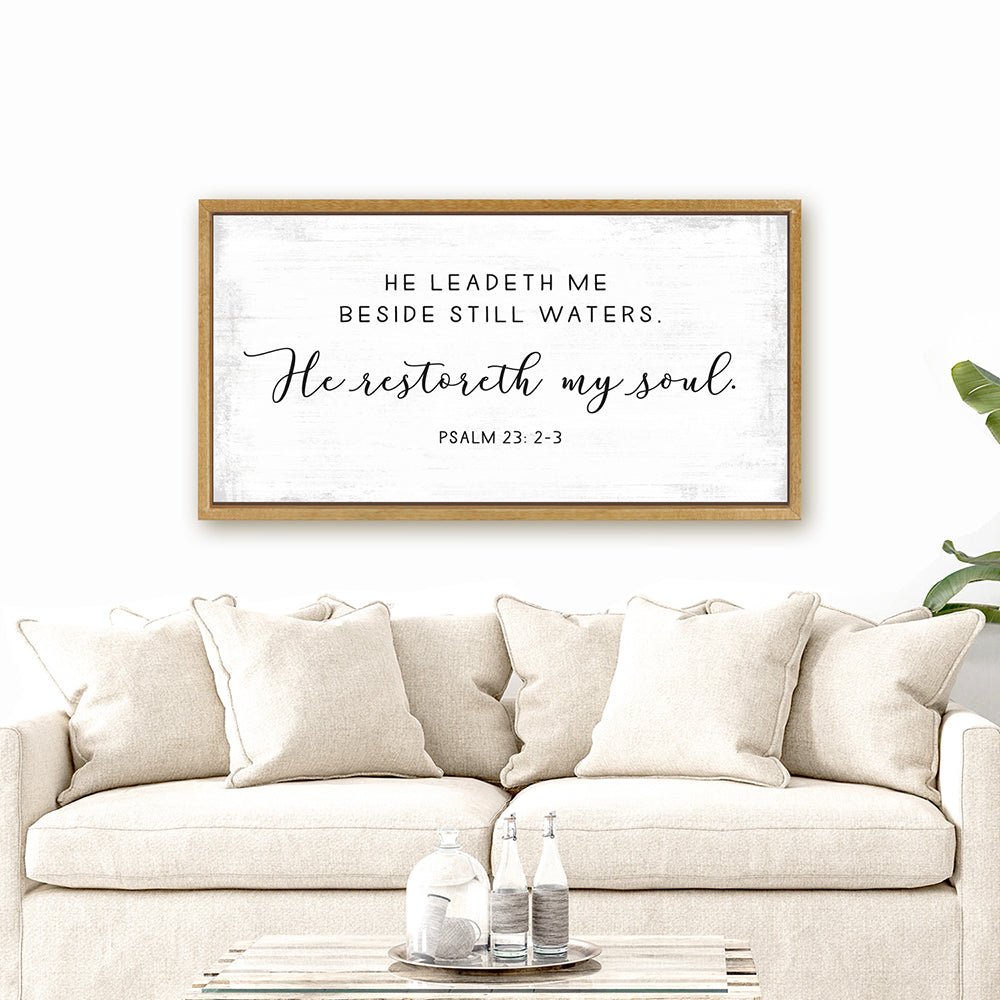 He Leads Me Beside Still Waters Psalm 23 Bible Verse Sign Hanging on the Wall Above the Couch - Pretty Perfect Studio