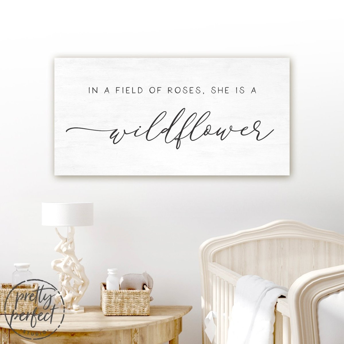 In A Field Of Roses She Is a Wildflower Sign Hanging Above Baby Crib - Pretty Perfect Studio