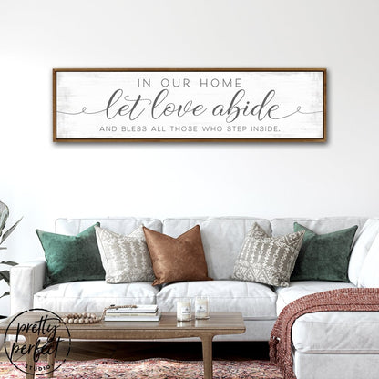 n Our Home Let Love Abide Sign Above Couch - Pretty Perfect Studio