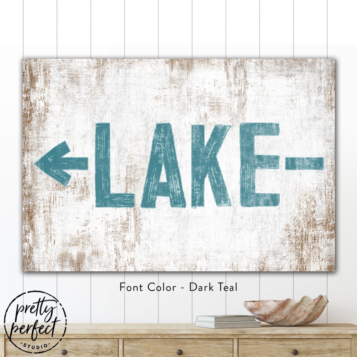 Lake arrow sign in a modern farmhouse living room with neutral color palette