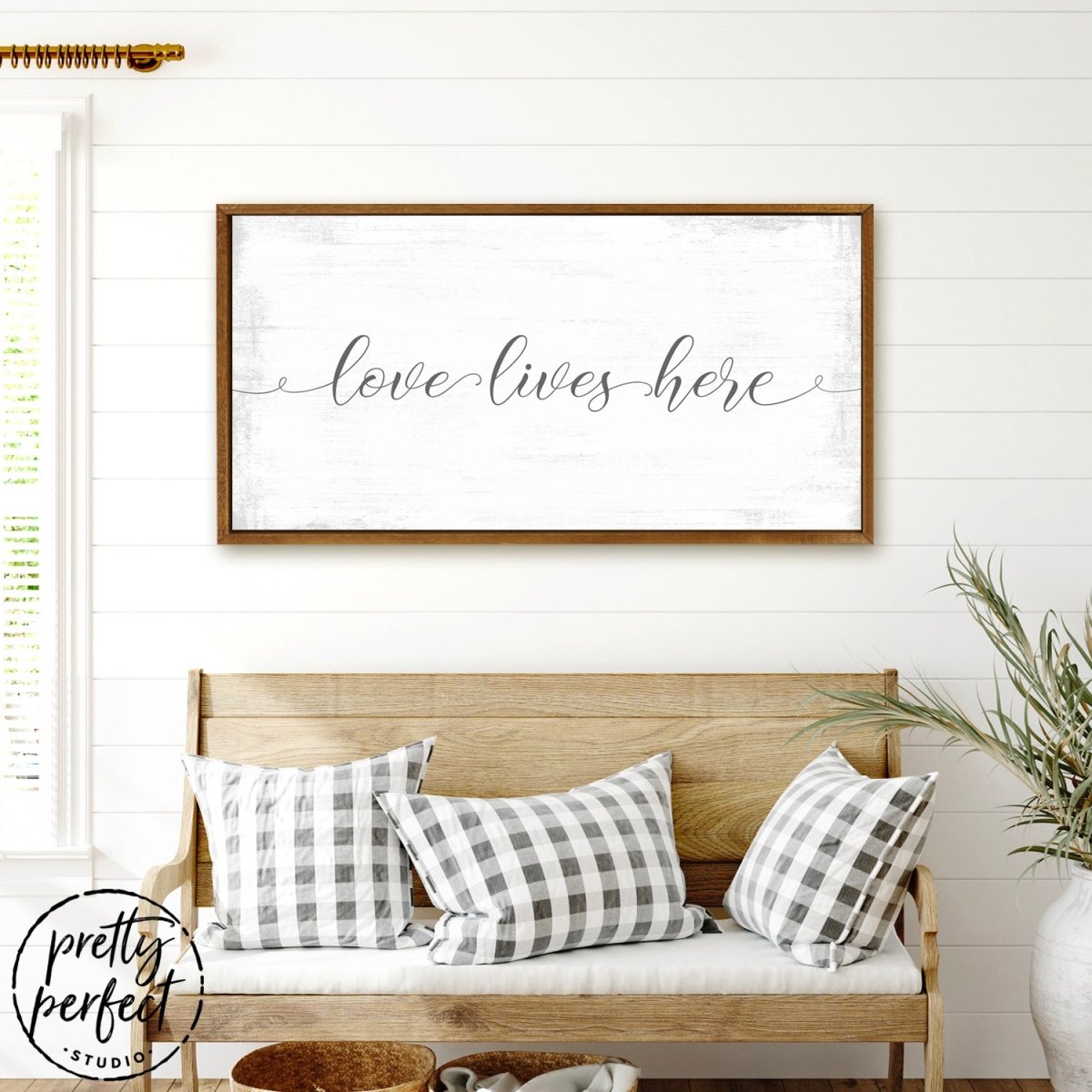 Love Lives Here Sign Above Couch - Pretty Perfect Studio