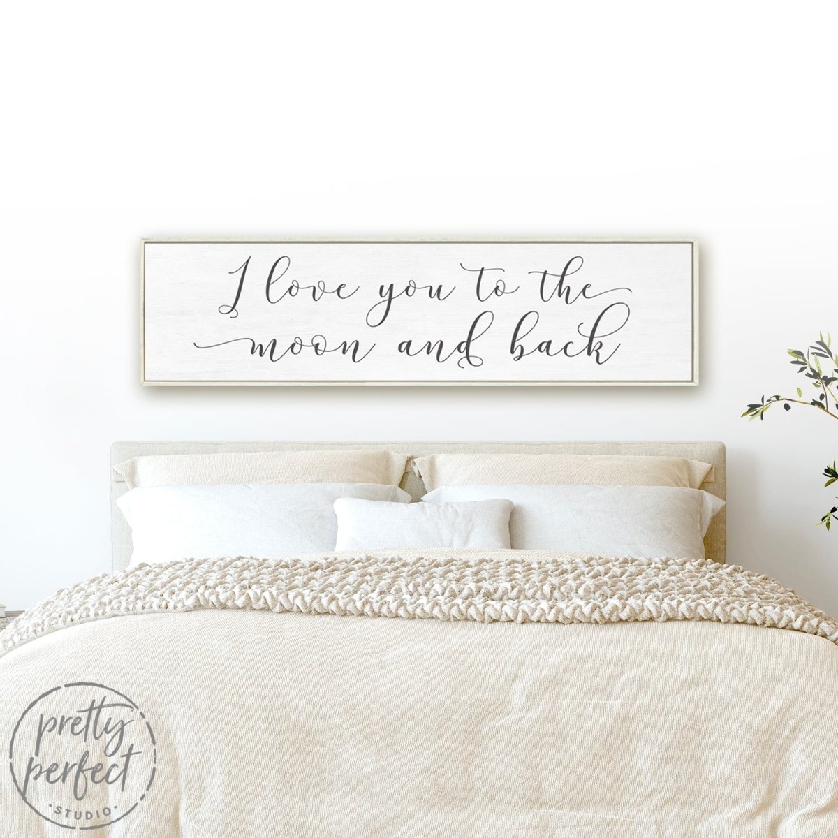 Love You To The Moon And Back Sign Above Bed in Couples Bedroom - Pretty Perfect Studio