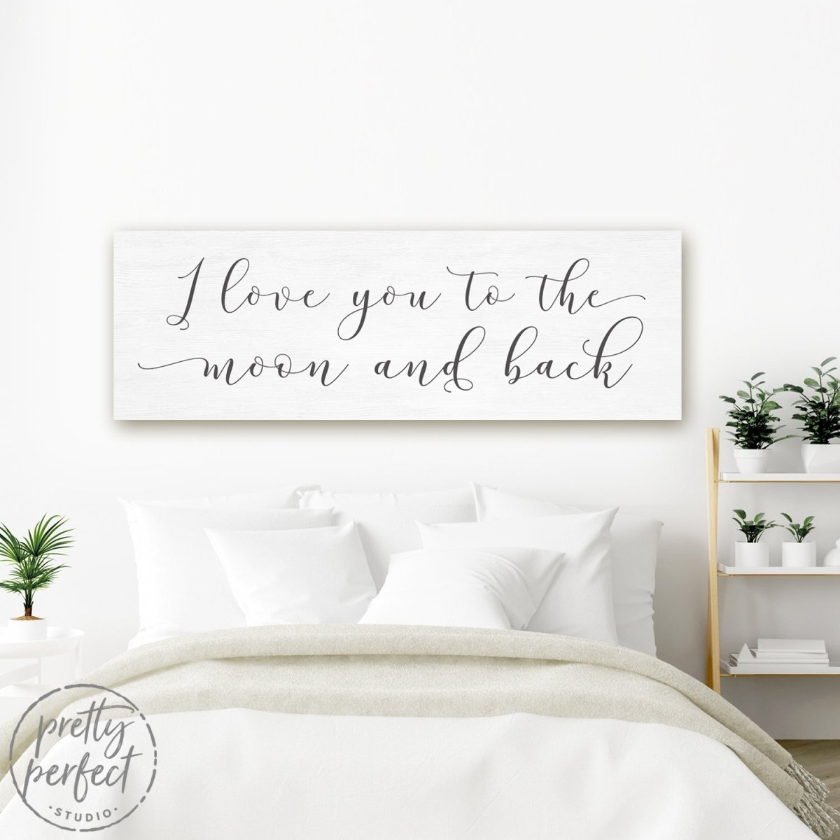 Love You To The Moon And Back Sign Above Bed in Couples Bedroom - Pretty Perfect Studio