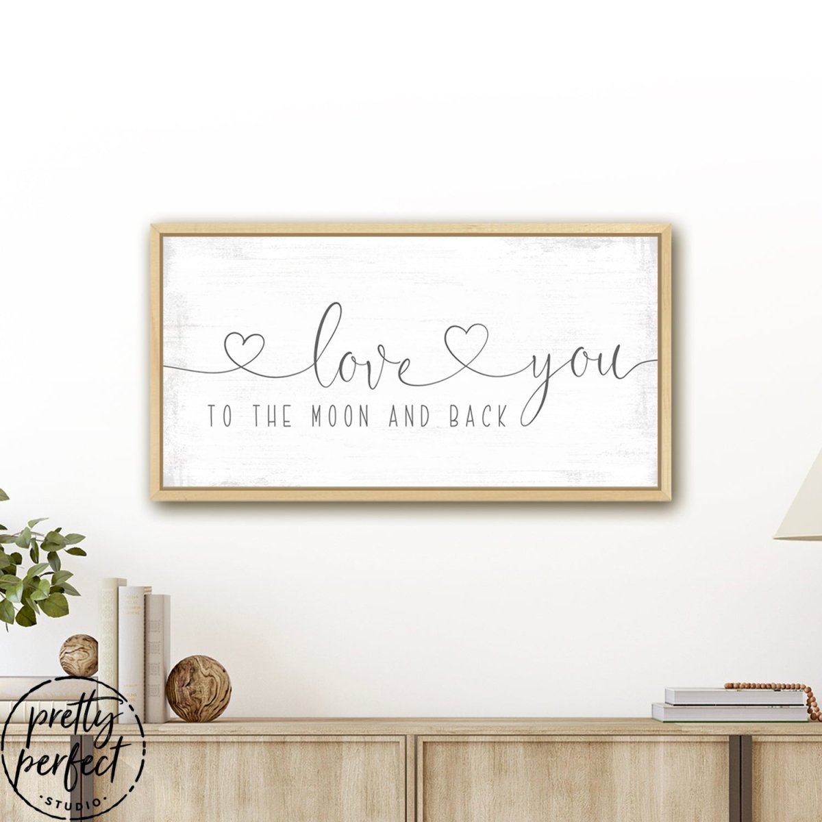 Love You to the Moon and Back Sign With Hearts Above Table - Pretty Perfect Studio