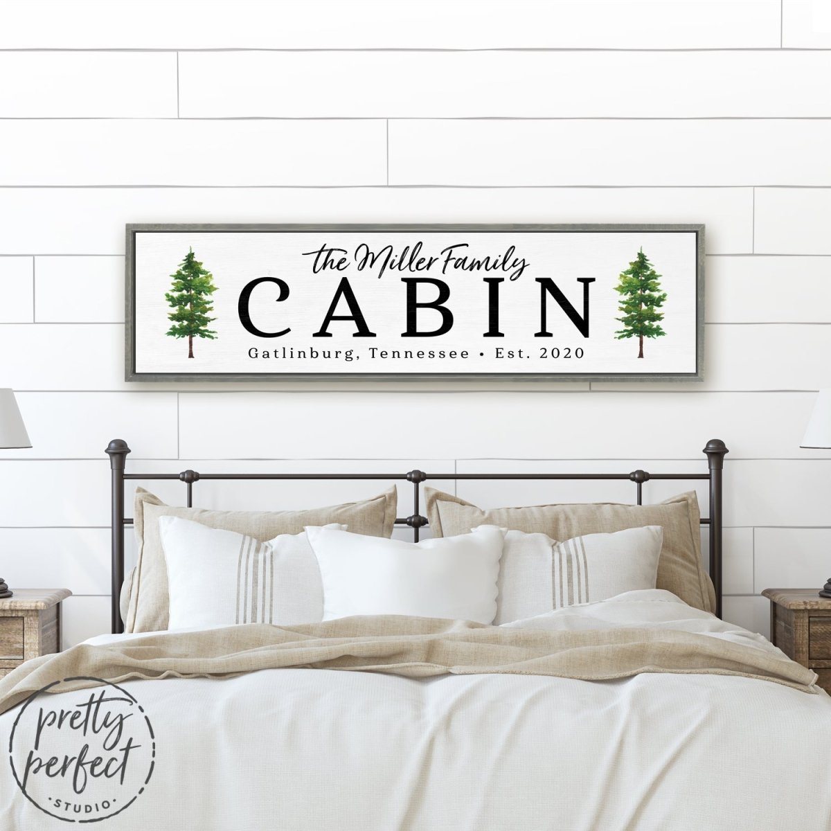 Personalized Family Cabin Sign With Location Hanging Above Bed - Pretty Perfect Studio