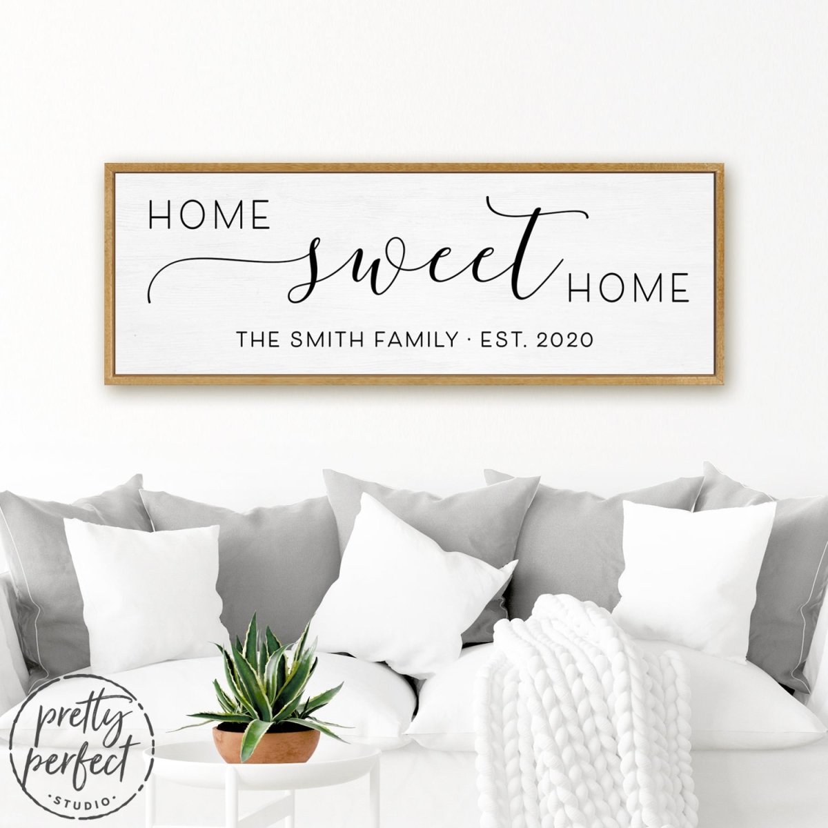 Personalized Home Sweet Home Sign Hanging on Wall Above Couch - Pretty Perfect Studio