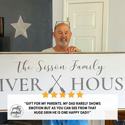 custom river house sign with family name held by happy customer personalized river house decor gift idea