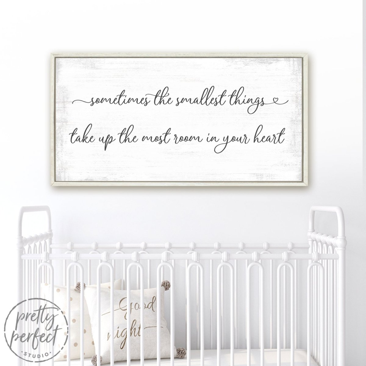 Sometimes The Smallest Things Take Up The Most Room In Our Heart Sign Above Baby Crib in Nursery - Pretty Perfect Studio