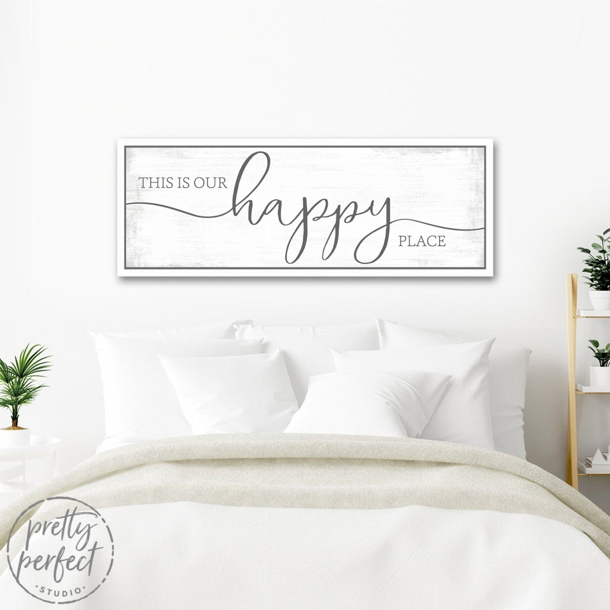 This Is Our Happy Place Sign Above Bed In Bedroom - Pretty Perfect Studio