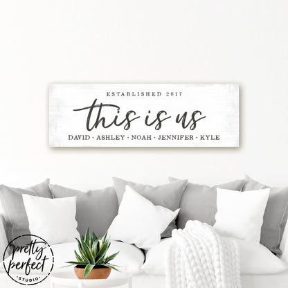 This Is Us Sign Personalized With Family Name & Date Above Couch in Living Room