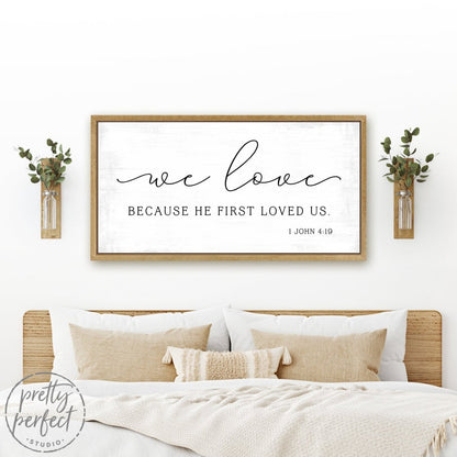 We Love Because He First Loved Us 1 John 4:19 Sign Hanging on Wall Above Bed - Pretty Perfect Studio